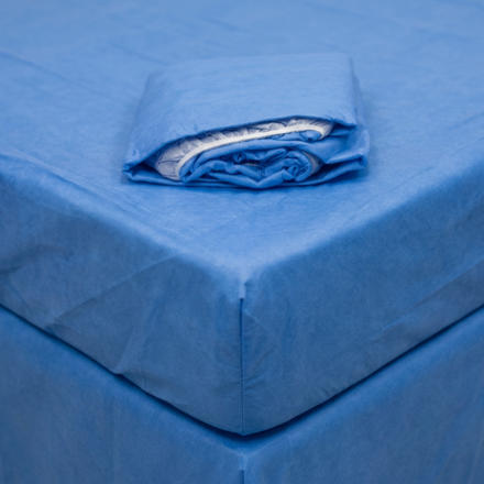 fitted bed sheet with absorbent pad shown on bed