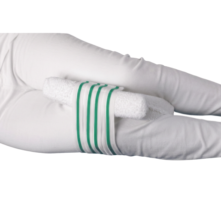 Knee cushion with terry cloth cover placed between legs