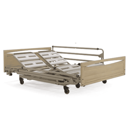 Dual sleeping surface bed shown from a front left angle with the backrest and knee-break sections raised, featuring full-length side rails, wooden head and foot boards, and a four-section adjustable mattress platform.